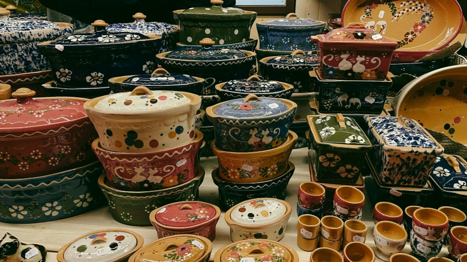 Collection of colorful ceramic pots and dishes